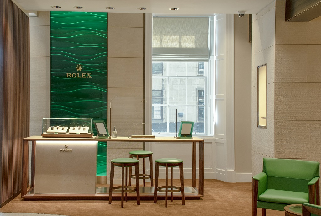 Laings Edinburgh Rolex shop-in-shop welcomes clients with the rich emerald green and gold associated with the iconic brand