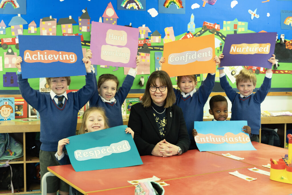 Liz Henderson, Headmaster of Craigclowan Prep School pictured with P1 pupils