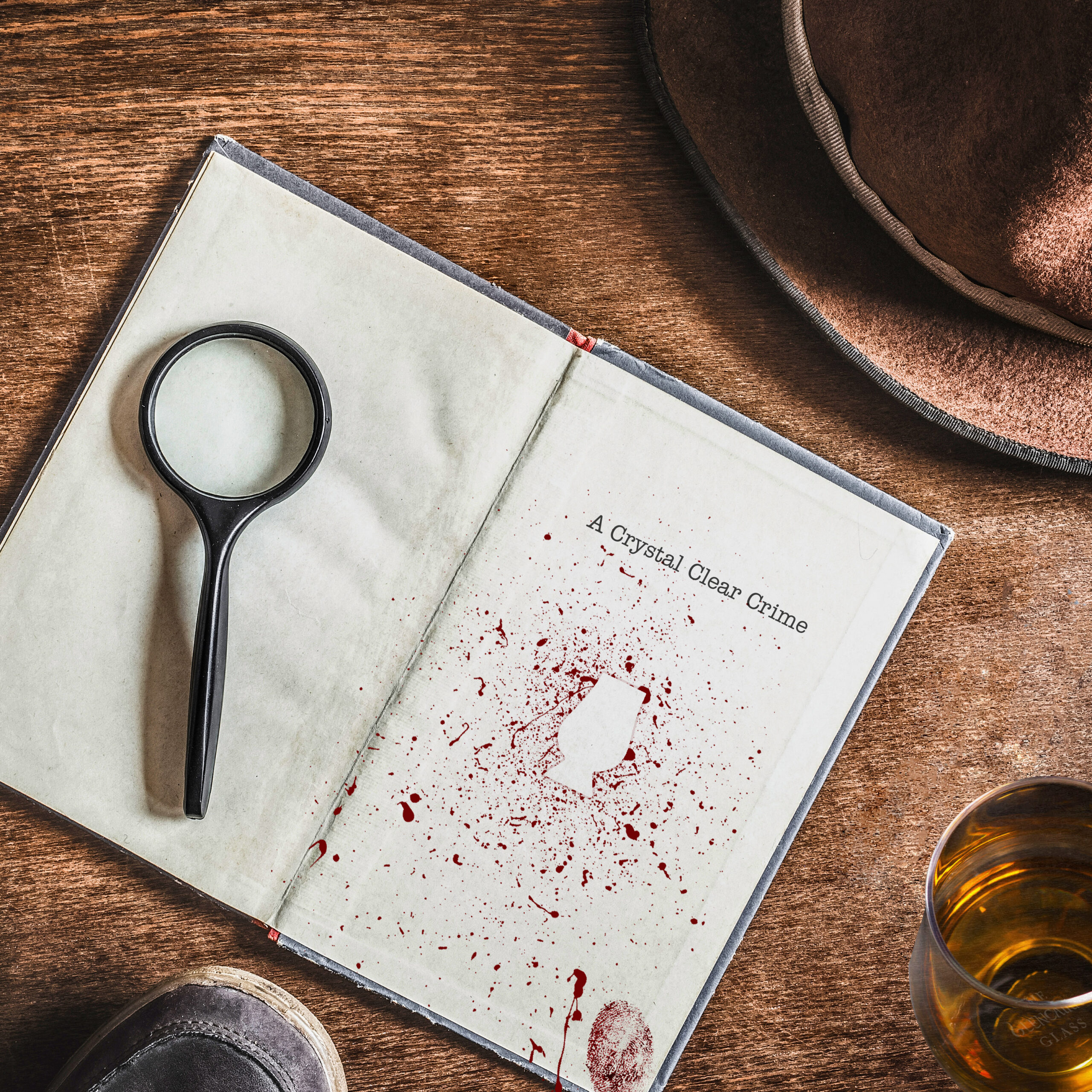 Opened old blank book with magnifying glass. Detective hat and shoes on brown background. Retro things. Historical atmosphere. Vintage english style. Evidence searching concept. Empty place for text.