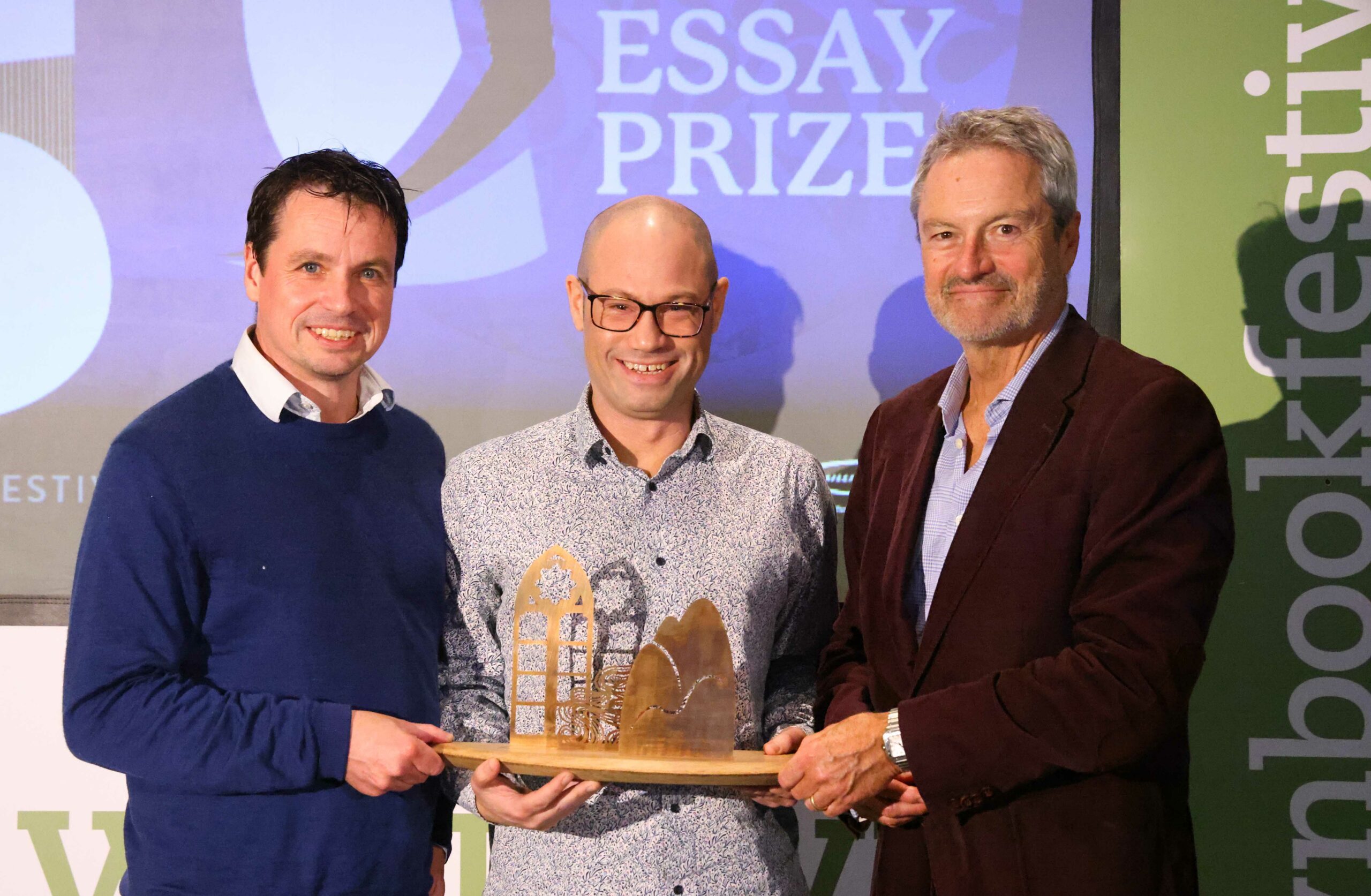 FREE PICTURE:  Anne Brown Prize Winner at Wigtown Book Festival, Mon 25/09/2023: 
 Author Rodge Glass (correct, centre) has been named the winner of the 2023 Anne Brown Essay Prize for Scotland.
 The £1,500 prize, established in 2021 by the family of the late BBC Scotland journalist and Wigtown Festival Company chair Anne Brown, celebrates the best literary essay by a Scottish writer. 
 Best-known for his biography of Alasdair Gray, Glass’s essay On the Covenant explores his relationship with his Jewish family and the idea of what belonging and ties of blood mean. 
 The Essay Prize, which was this year run in association with The Herald, was awarded yesterday [Sunday, 24 September 2023] at a special event at Wigtown Book Festival.
Pictured with Rodge Glass (centre) is Adrian Turpin (left), Creative Director at Wigtown Book Festival and broadcaster and author Gavin Esler (right, chair of the judging panel).
More information in accompanying Press Release and from: Matthew Shelley, PR Consultant for Wigtown Book Festival - Matthew@ScottishfestivalsPR.org - 07786 704 299. 
 Photography for Wigtown Book Festival / Wigtown Festival Company from: Colin Hattersley Photography - www.colinhattersley.com - cphattersley@gmail.com - 07974 957 388.