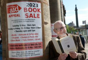 FREE PICTURE:  Book Sale Launch for Christian Aid Scotland, Edinburgh, Thur 11/05/2023:
Scotland’s biggest charity book sale opens its’ doors this weekend, Edinburgh :
Scotland’s largest and oldest charity book sale opens on Saturday (13 May 2023, 10am to 4pm) at St Andrew’s and St George’s West Church for its 51st year.  
Thousands of books in every genre will be available to browse and buy. 
  Pictured is Scottish writer James Robertson - Patron of this year’s book sale and author of The Testament Of Gideon Mack which is currently one of the the texts studied by students sitting National 5 English exams.
  This year’s sale Patron is James Robertson, award-winning Scottish author and co-founder of Itchy Coo, the Leith-based publishing house specialising in Scots language books for children and young adults.  One of Robertson’s books, “The Testament of Gideon Mack”, was long listed for the Booker Prize and is currently one of the texts studied by school pupils sitting National 5 English exams.
 More information in accompanying Press Release or from: Jo Dallas, media officer at Christian Aid Scotland - 07778 109 541- JDallas@christian-aid.org
 Photography for Christian Aid Scotland from: Colin Hattersley Photography - www.colinhattersley.com - cphattersley@gmail.com - 07974 957 388.