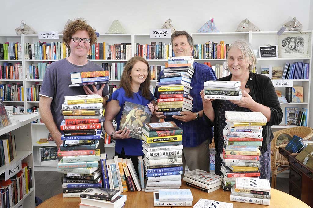 FREE PICTURE: Wigtown Book Festival 2018 Programme Launch, Scotland, 16/08/2018:
Packed Programme Unveiled for the 20th Wigtown Book Festival: 
Scotland’s National Book Town celebrates with 10 days of events and entertainment featuring authors, campaigners, comedians and poets - from 21st to 30th September (2018).
Highlights include broadcaster, writer and presenter Clare Balding, comedian Susan Calman who danced her way into the hearts of millions on Strictly, and bestselling author Patrick Gale. And there will also be a series of events as special celebrations for the National Book Town’s 20th festival.  Full information at: www.wigtownbookfestival.com
  Pictured launching the festival programme are (from left) local author Shaun Bythell (correct, who is also the owner of the town’s longest established bookshop, “The Bookshop”),  festival operations director Anne Barclay, and Wigtown authors Mike Morley and Mary Gladstone. Pictured with a rage of books by authors featured in this year's festival.
More information from:  Matthew Shelley, PR Consultant for Wigtown Book Festival - 07786 704 299 - matthew@scottishfestivalspr.org
 Photography for Wigtown Book Festival from: Colin Hattersley Photography - www.colinhattersley.com - cphattersley@gmail.com - 07974 957 388.
**FREE Picture - FIRST USE ONLY** - within 30 days of origination of photography; all other publications to be paid for - please contact photographer for details.