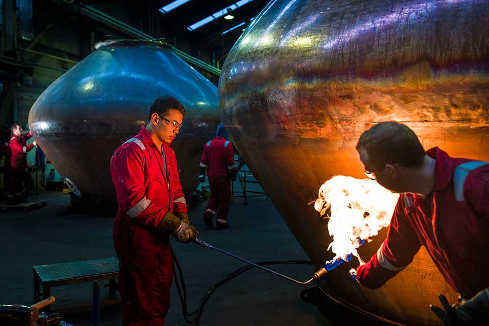 Coppersmiths making whisky stills