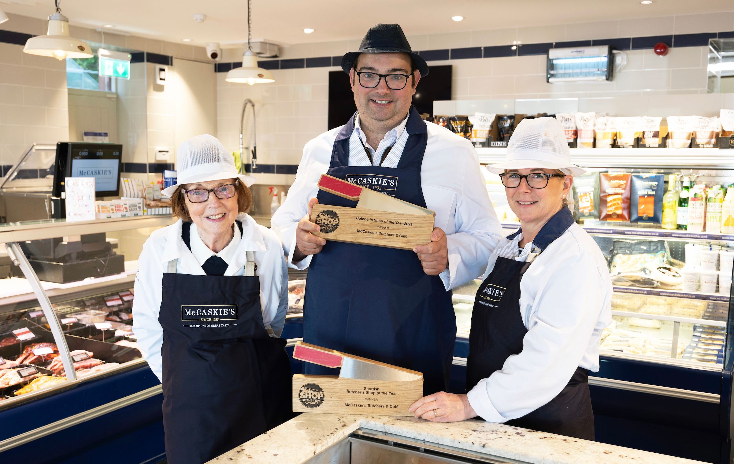 Nigel Ovens of McCaskie's Butchers in Wemyss Bay who has won the UK Butcher's Shop of the Year pictured with his mother Elizabeth and wife Helen. Picture by Graeme Hart.