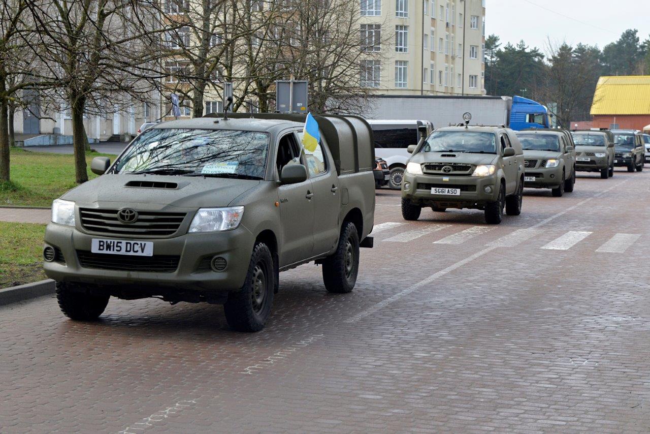 Pickups for Peace convoy, the vehicles are painted a military khaki