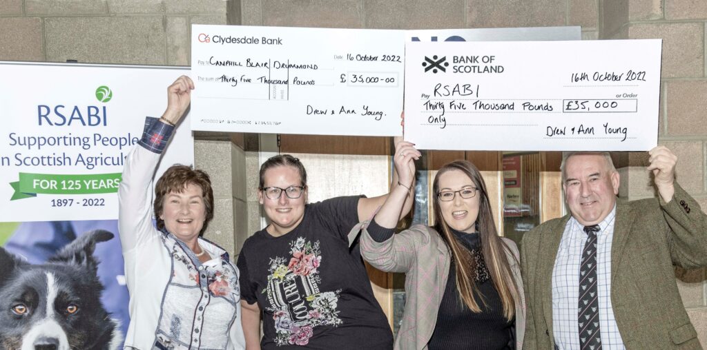 Charity - the Young family with their cheques