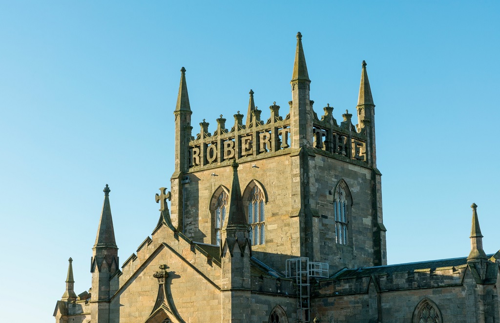 Dunfermline Abbey with 'Robert the Bruce' carved in stone at the top.
