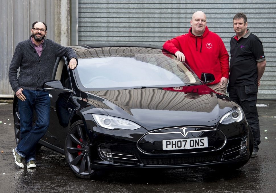 Glasgow Museums is gifted a Tesla Model S P85+, and pictured are (from left) Neil Johnson-Symington, Curator of Transport and Technology with Glasgow Museums, Chris Clarkson, who gifted Glasgow Museums the car, and Andy Howe, Conservator of transport and technology at Glasgow Life.