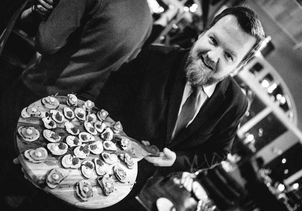 Mark Patonyi serving canapes