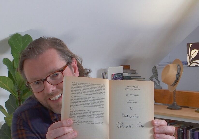 Damian Barr with his signed copy  of Quentin Crisp's work