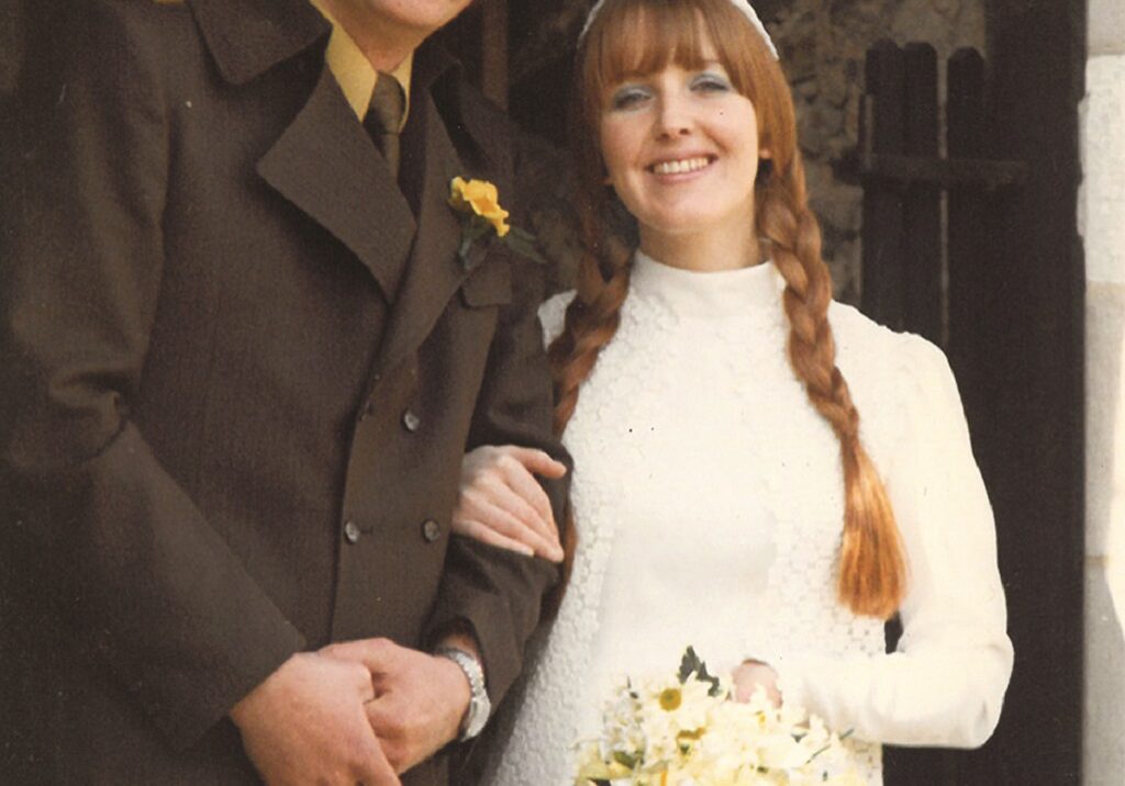 Sheila Fleet wearing her lace daisy dress on her wedding day to Rick