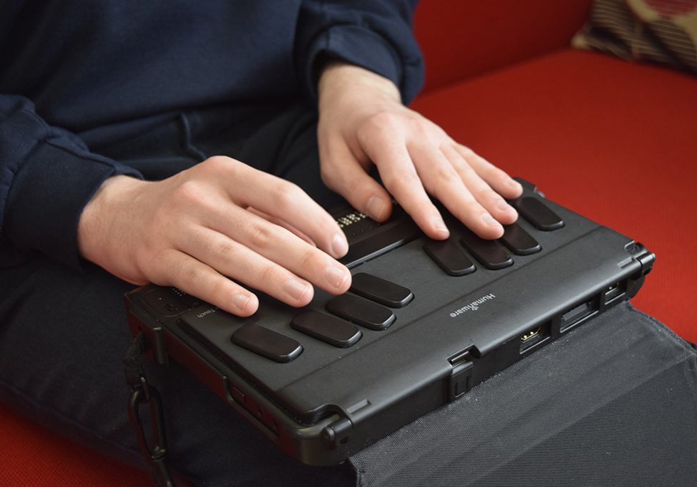 Andrew types with a braille keyboard at the Royal Blind School (Picture: Royal Blind).