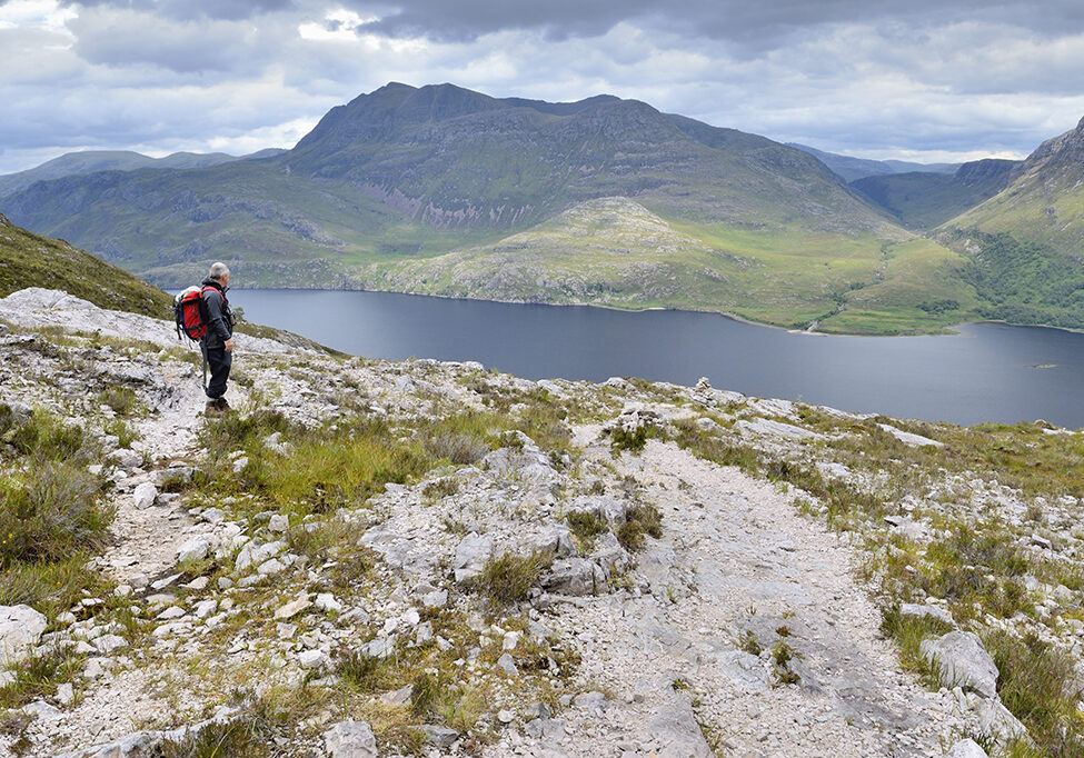 A hillwalker enjoying the view over Loch Maree from the mountain trail at Beinn Eighe National Nature Reserve (Photo: Lorne Gill/SNH)