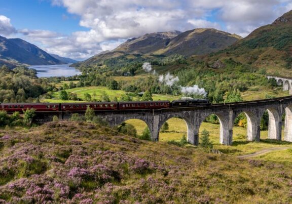 Jacobite steam train over the Glenfinnan Viaduct. Credit: Adobe Stock.