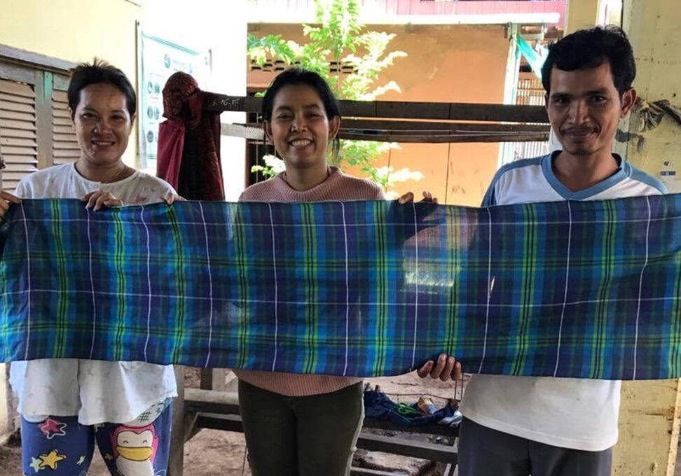 Anak with weavers in Cambodia