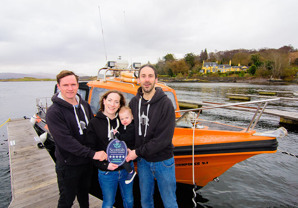 Head Guide Luke Saddler, Owners Nikki and Shane Wasik with Mara, of Basking Shark Scotland at their dive boat ‘Cearban’.