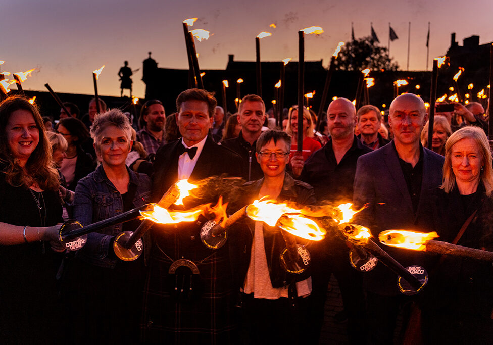 (L-R) Claire Askew, Denise Mina, David Baldacci, Doug Johnstone, Manda Scott, Craig Robertson and Ambrose Parry (Chris Brookmyre and Marisa Haetzman) photographed at the torchlit procession at Stirling Castle for Bloody Scotland(Photo: Paul Reich)