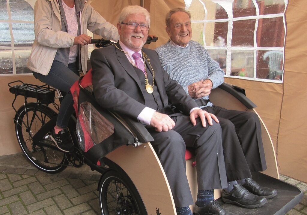 Pensioners are enjoingy the companionship in trishaws