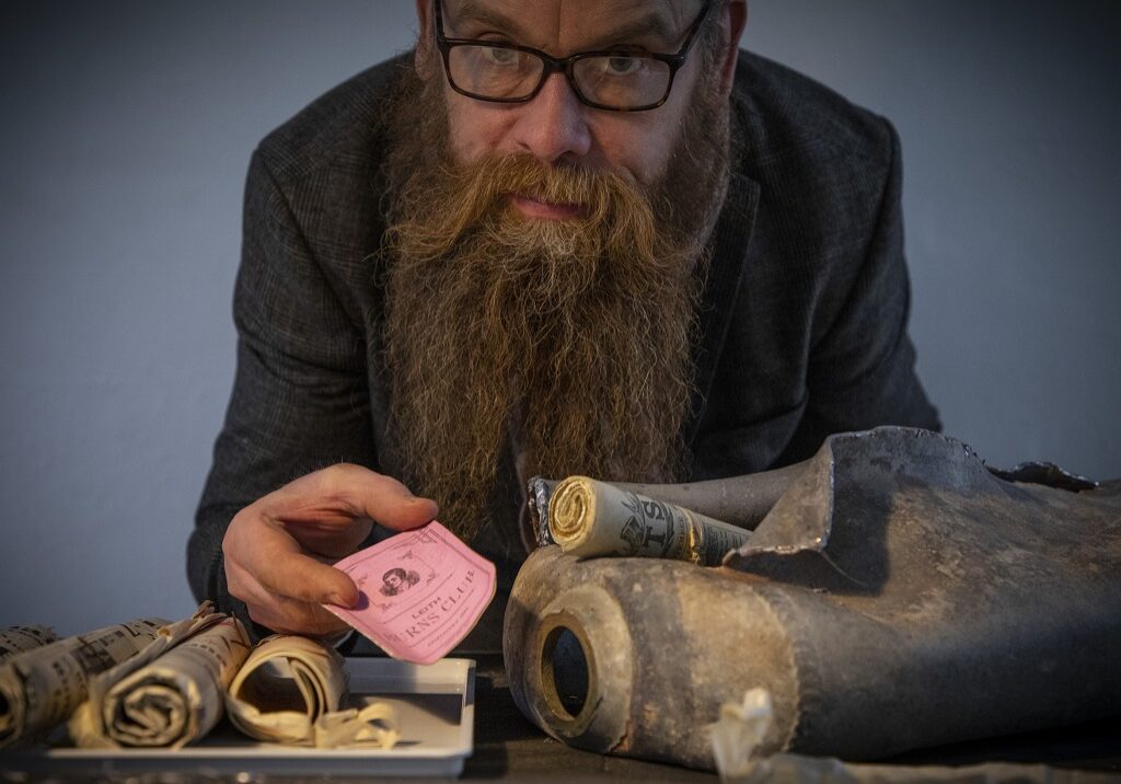 Conservator Nic Boyes displays the findings