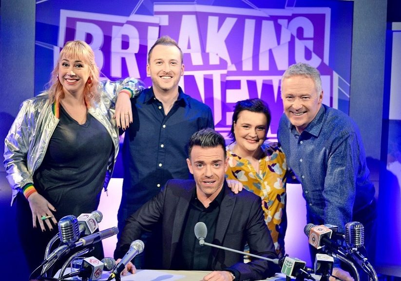 Des (seated) hosts BBC Scotland topical quiz show Breaking the News