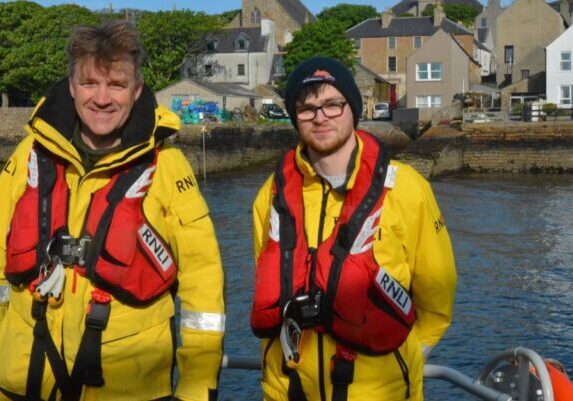 James and Lewis Burgon on Stromness RNLI Lifeboat. Credit: Richard Clubley.
