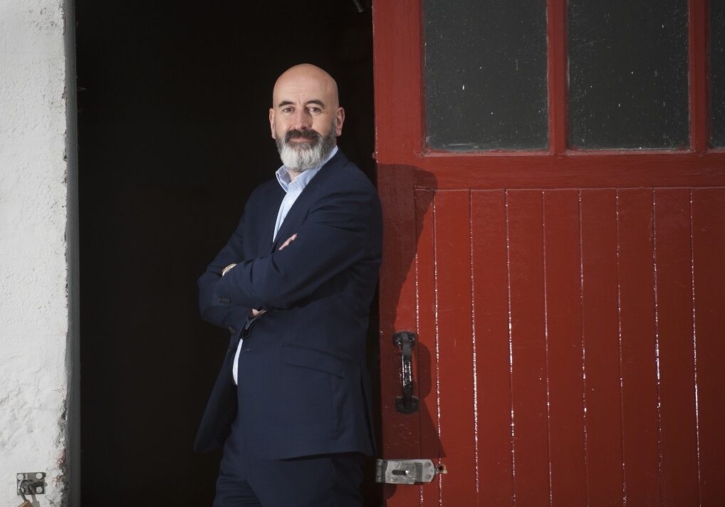 Ewen Mackintosh, Benromach’s managing director, at the famous red doors