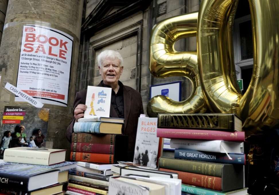 FREE PICTURE:  50th Book Sale for Christian Aid, Edinburgh, 12/05/2022:
Book fans delight as Christian Aid book sale on Edinburgh’s George Street returns for its 50th sale:
Scotland’s biggest charity book sale opens its doors for the 50th time this Saturday.  In the last decade alone, the book sale at St Andrew’s and St George’s West Church on George Street, Edinburgh, has raised over a million pounds for international development charity Christian Aid.  
  Pictured on the steps of the St Andrew’s and St George’s West Church  is Glasgow-based writer Bernard MacLaverty, author of five novels and six short-story books, and the patron of this year’s 50th sale. Bernard has revealed that he has attended the sale since the mid-1970s and much enjoys buying books.
  The sale opens this Saturday 14th May (2022) and runs again from Monday 16th to Friday 20th May - see:: https://www.stagw.org.uk/
  More information in the accompanying Press Release and from Christian Aid Scotland media officer Jo Dallas  -  07778 109 541 - jdallas@christian-aid.org
  And more info about Christian Aid Week and events taking place can be found at:  www.christianaid.org.uk/get-involved-locally/scotland/christian-aid-week-in-scotland
  Photography for Christian Aid Scotland from: Colin Hattersley Photography - www.colinhattersley.com - cphattersley@gmail.com - 07974 957 388.