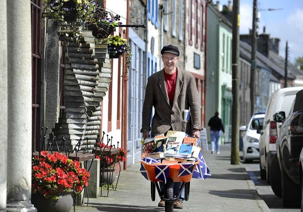 Barrow loads of book fun with Andrew Wilson, owner of the Beltie Books bookshop in the town (Photo: Colin Hattersley)