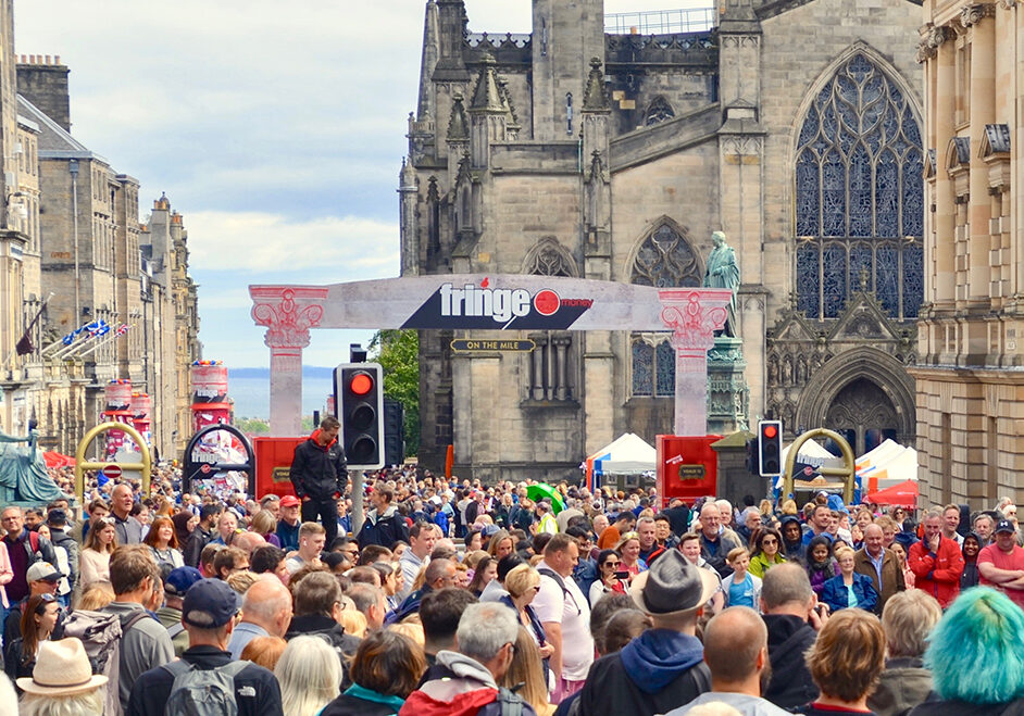 Crowds of tourists on the Royal Mile for the Edinburgh annual Fringe Festival (Photo: Lou Armor/Shutterstock)
