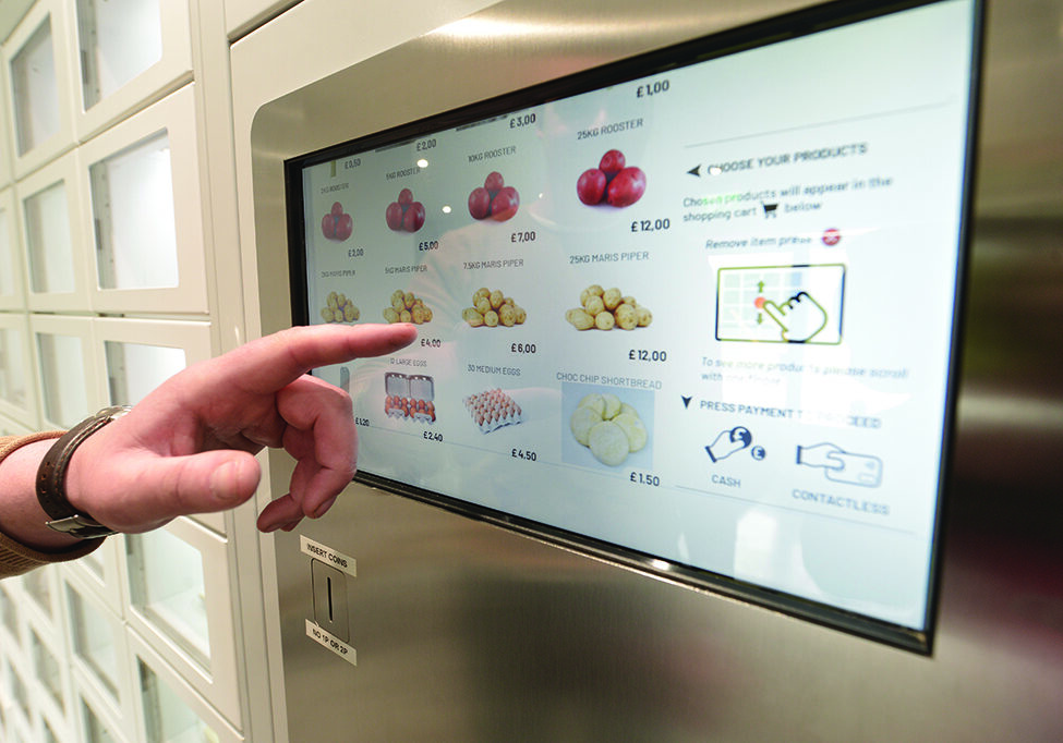 Selecting fresh vegetables from the vending machine (Photo: Angus Blackburn)