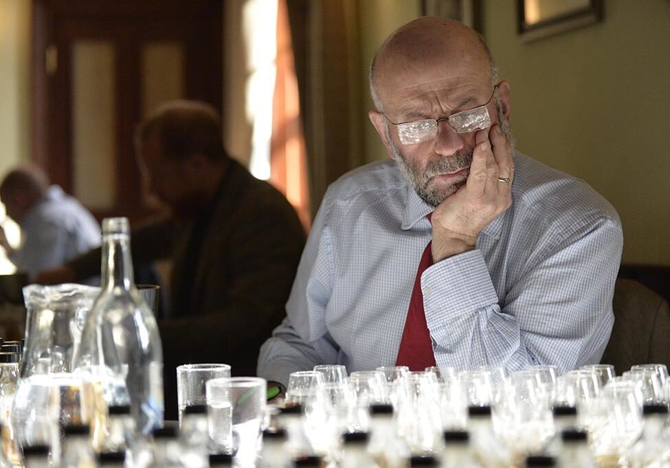 Judge Vince Fusaro contemplates his whiskies