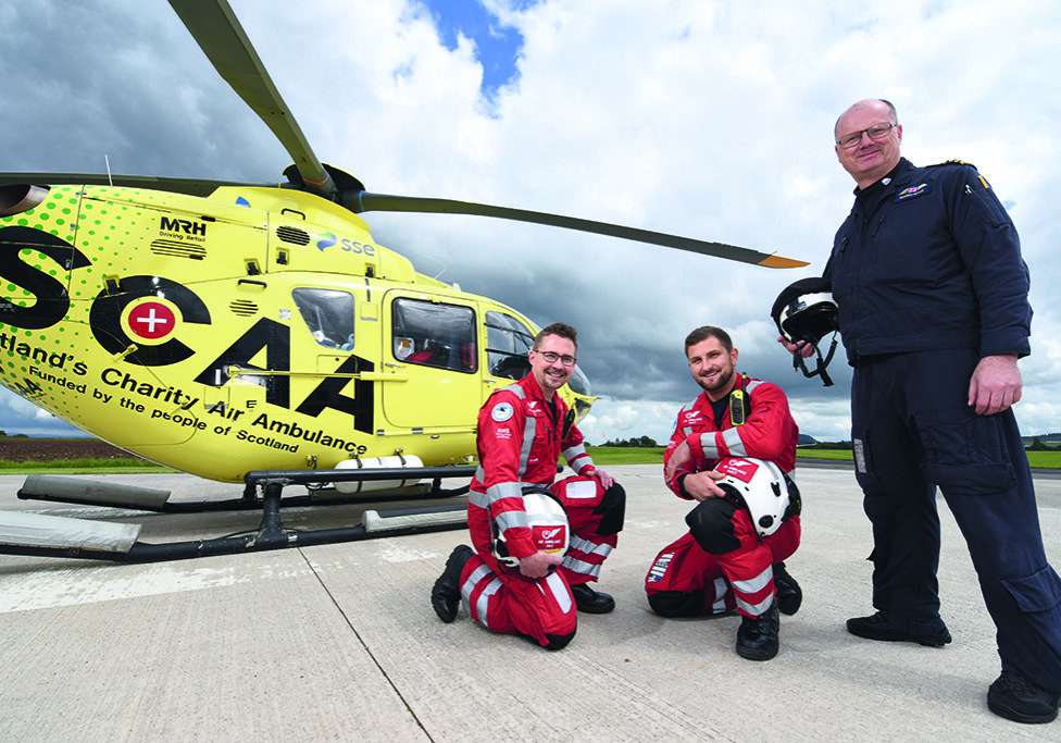 Paramedics Darren O’Brien and Matt Allen, and pilot Russell Myles work at the Perth base of Scotland's Charity Air Ambulance (Photo: Angus Blackburn)