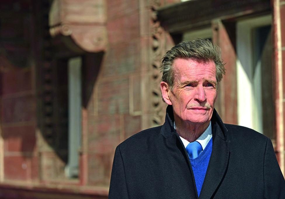 William McIlvanney on the street of Glasgow.