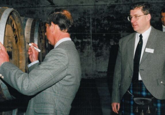 HRH Prince Charles with Ian Urquhart Signing First Cask at Benromach.