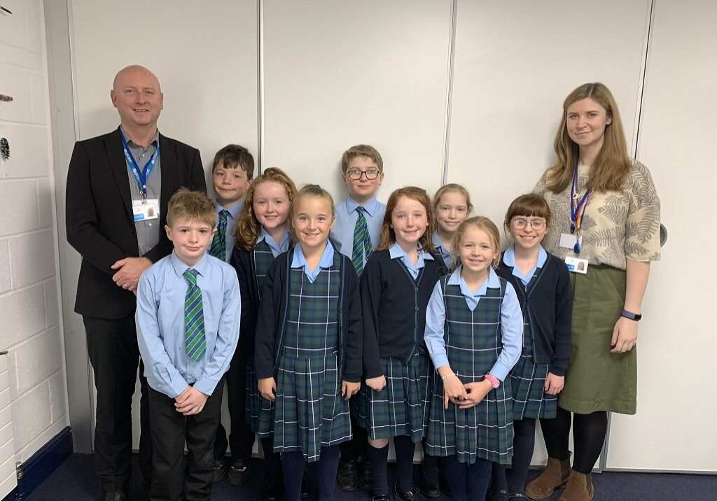 P5 Lomond pupils with their diffusion tube outside the school, and another of the pupils with Gerrie McMurtrie, UNICEF senior professional advisor for Rights Respecting Schools, and Jessica Bool, UNICEF youth Strategy Lead