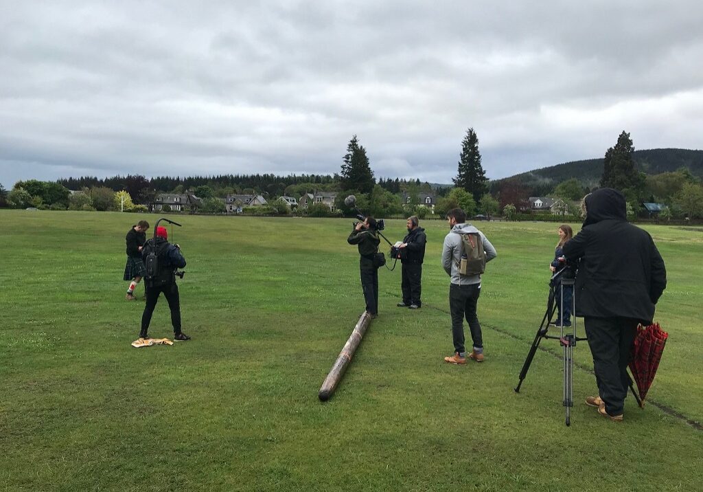 Jamie Dawkins (in kilt) during filming of Walking Britain's Lost Railways on Aboyne Green