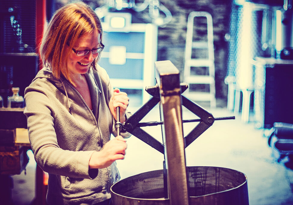 Katie Sime operating the apple press