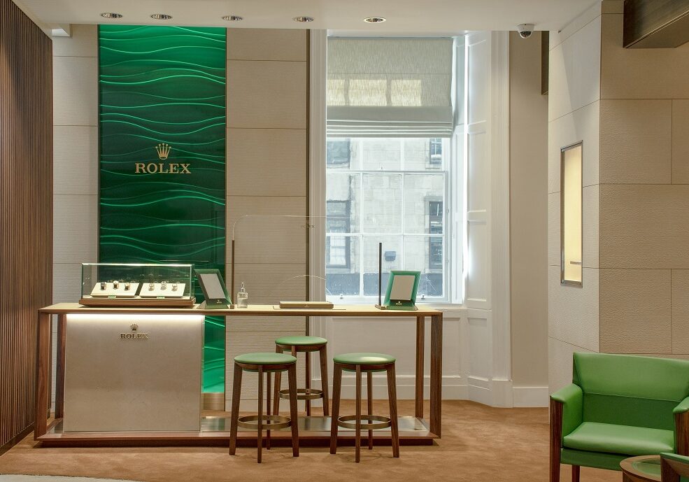 Laings Edinburgh Rolex shop-in-shop welcomes clients with the rich emerald green and gold associated with the iconic brand