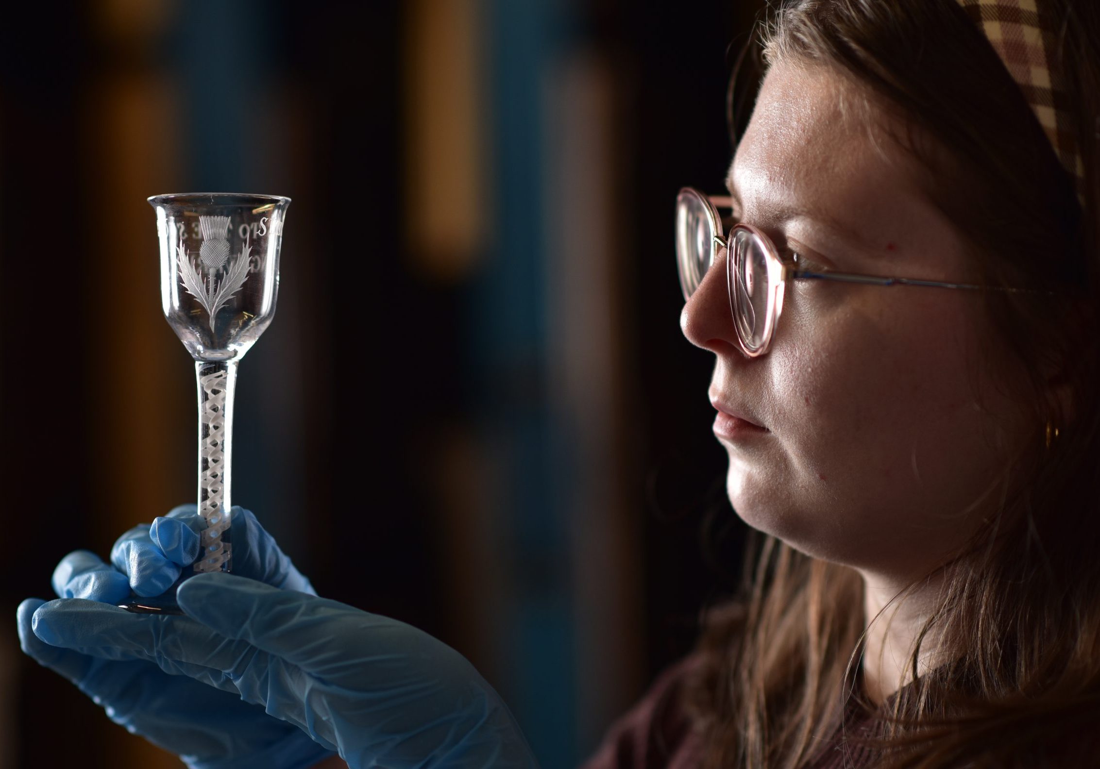 Lucy-Brayson-Collections-Assistant-at-Perth-Museum-holds-an-18th-century-Jacobite-Glass.-Photo-Julie-Howden-1-24byckval-scaled