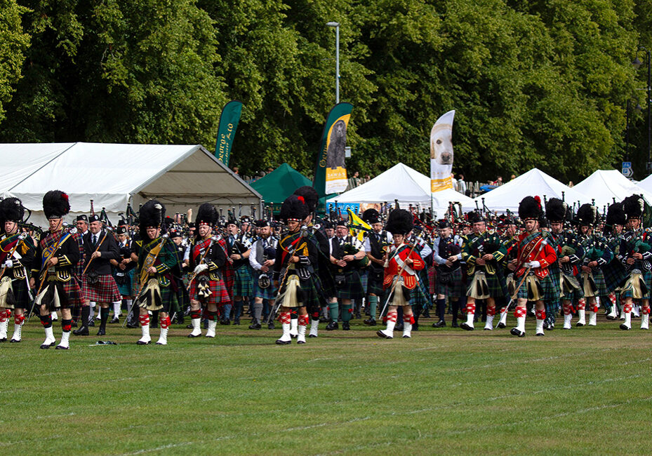 Massed pipe bands at the Aboyne Highland Games