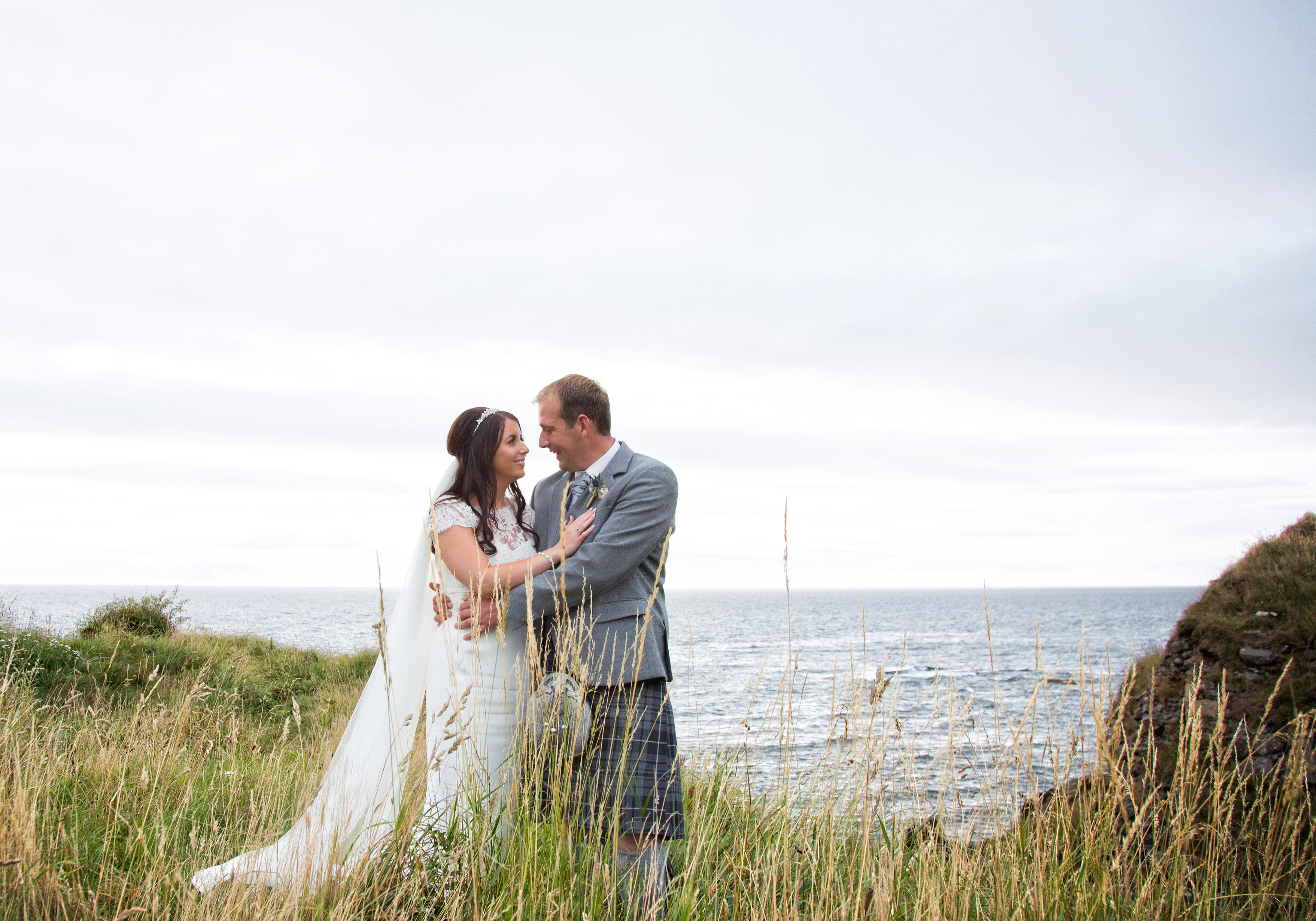 A delighted couple celebrate their marriage in the ground of Trump Turnberry