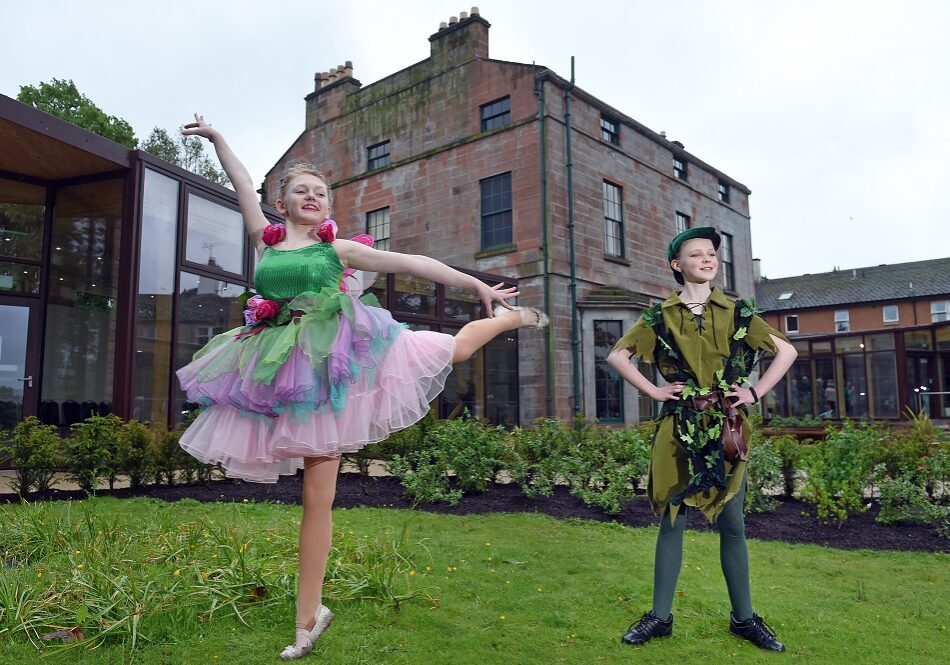 Dreams Can Come True Ð Joanna
Lumley Celebrates Moat Brae Opening
Cabinet Secretary Fiona Hyslop applauds agencies, charities and community for giving a new future to the house that inspired Peter Pan
The opening of Moat Brae, the house and garden where Peter Pan began, was celebrated
with a colourful garden party hosted the trustees of the Peter Pan Moat Brae Trust (PPMBT)
along with Patron Joanna Lumley.
Among the guests at Friday afternoonÕs event, which was held to thank supporters and
funders and welcome future partners, was Scottish Government Cabinet Secretary for
Culture and Tourism Fiona Hyslop MSP.
Saved from demolition 10 years ago the beautiful Georgian property overlooking the river
Nith, in Dumfries, has been restored and transformed into ScotlandÕs new National Centre
for Storytelling and ChildrenÕs Literature.


Pic caption: Peter Pan and  Tinkerbell played by  Morvin Terrace and  Jorja Lindsay aged 14 from Dumfries Academy at the official opening