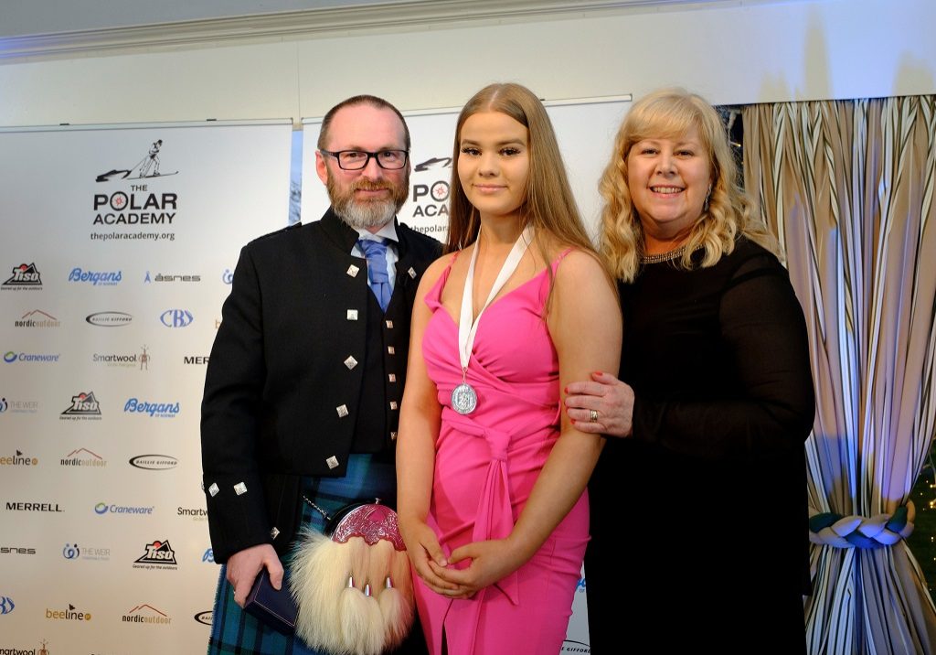 Alex Cochrane pictured with her mum Fiona Cochrane and Craig Mathieson, founder of The Polar Academy during the medal ceremony (Photo: Mike Wilkinson Photography)