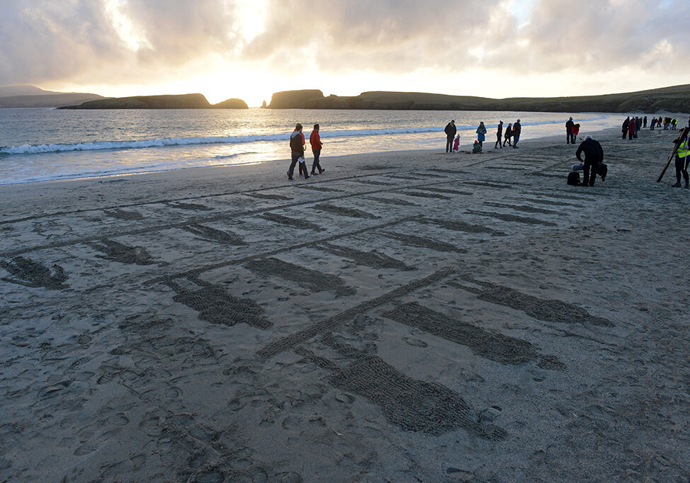 Members of the public gather on St Ninian's Isle Beach, Shetland for filmmaker Danny Boyle’s Pages of the Sea (Photo: Dave Donaldson)