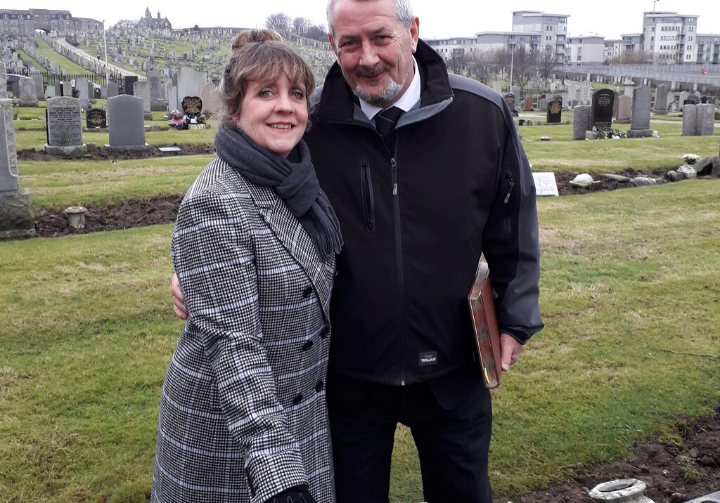 Sally Nilsson and Ian Burnett at the graveside