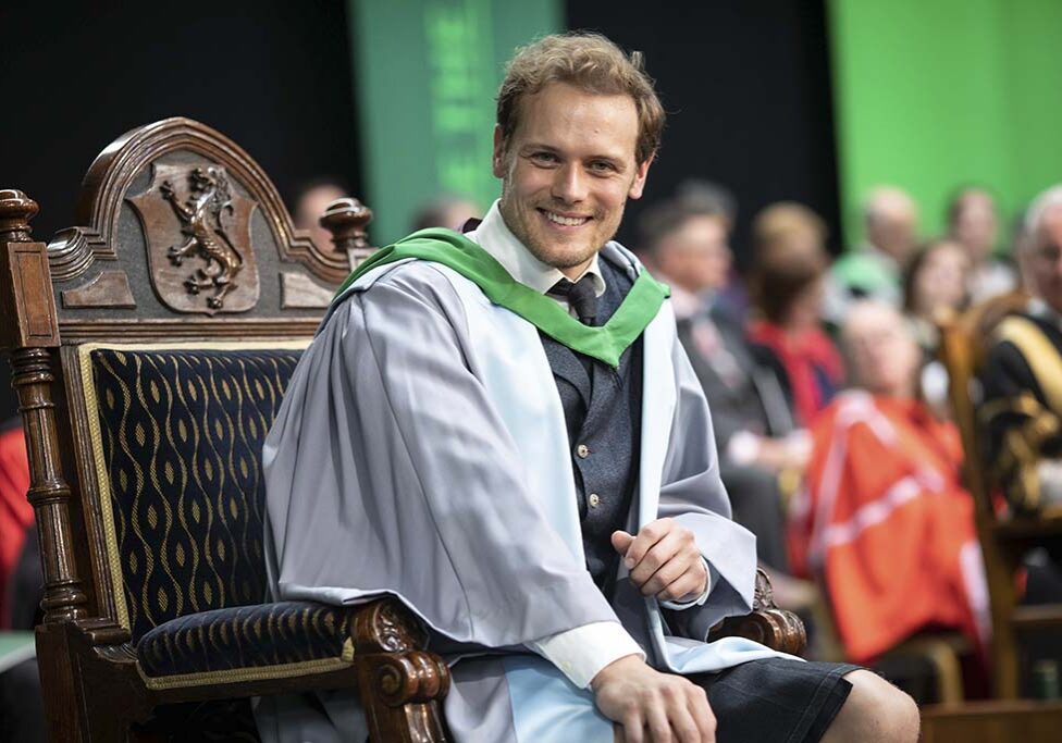 Outlander star and scots actor Sam Heughan receiving his honarary doctorate from Chancellor Jack McConnell at University of Stirling 27/6/19