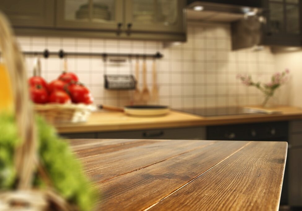 Wooden,Table,Of,Free,Space,In,Kitchen,And,Blurred,Vegetables