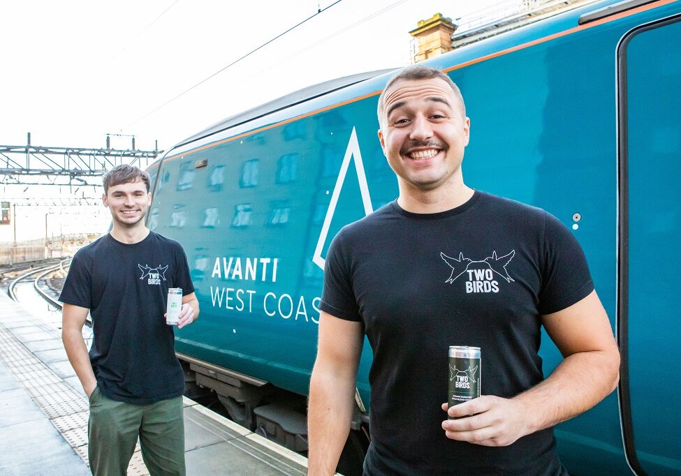 Two Birds founder and Director Daniel Stevenson (with moustache) and Colin Matheson Marketing Manager of Two Birds, visit the Avanti First Class Service at Glasgow Central Station