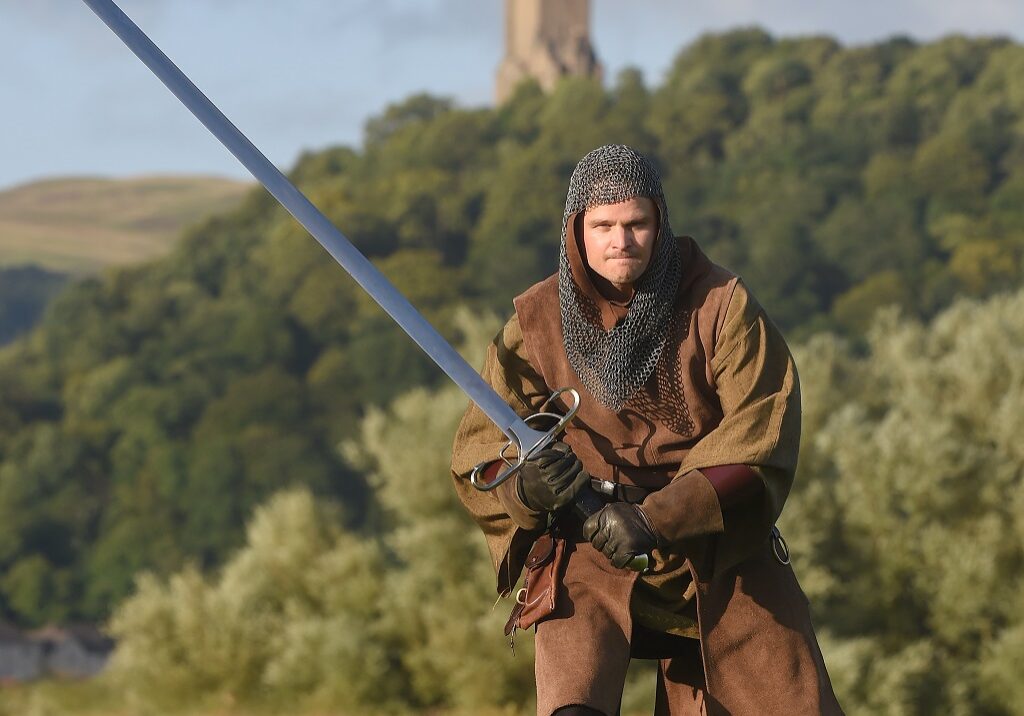 Actor Gilchrist Muir poses as Sir William Wallace, in front of The National Wallace Monument. (Photo: Whyler Photos of Stirling)
www.whylerphotos.com - 01786 474340