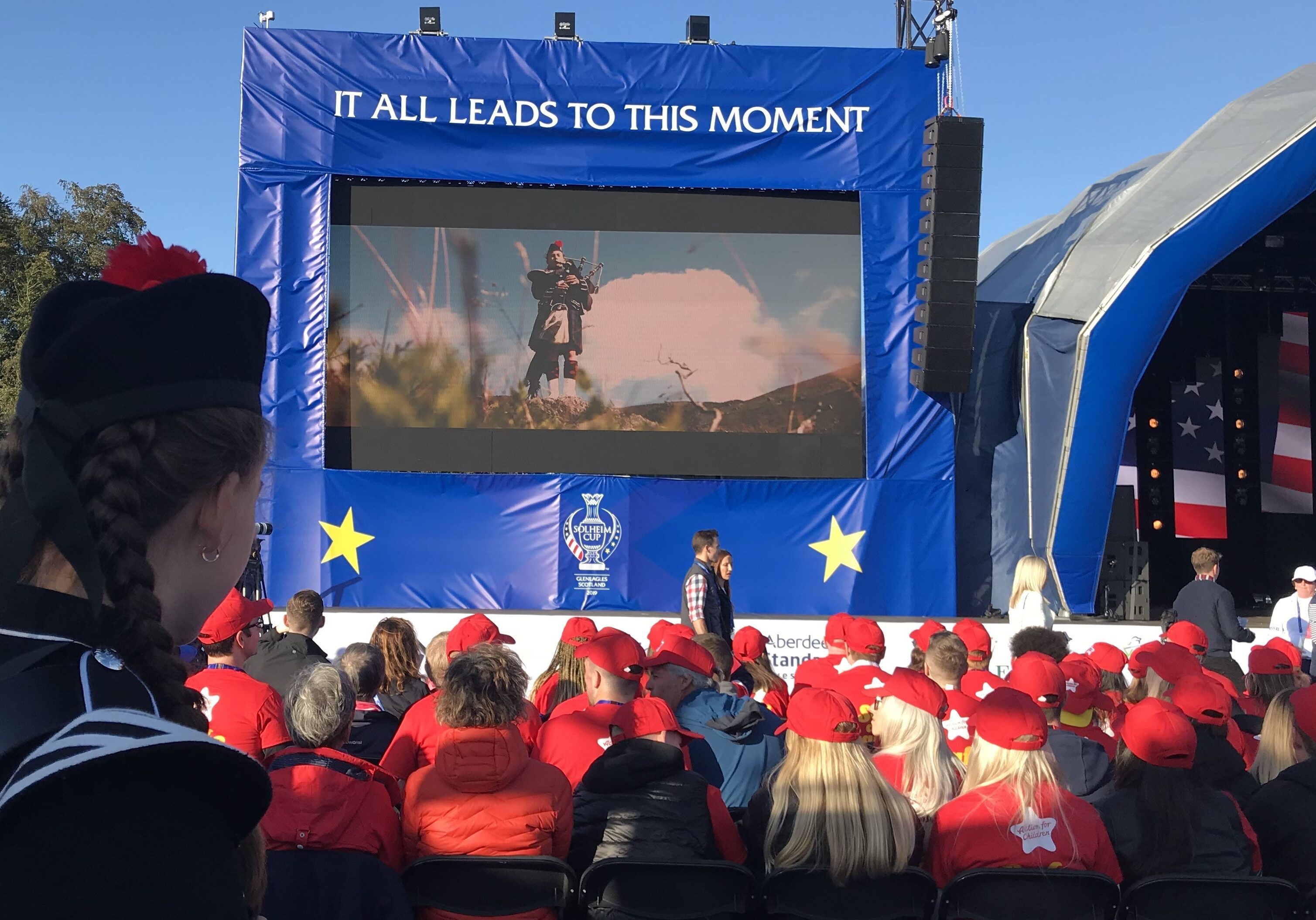 Ailise Milroy, a piper from Morrisons Academy, on stage